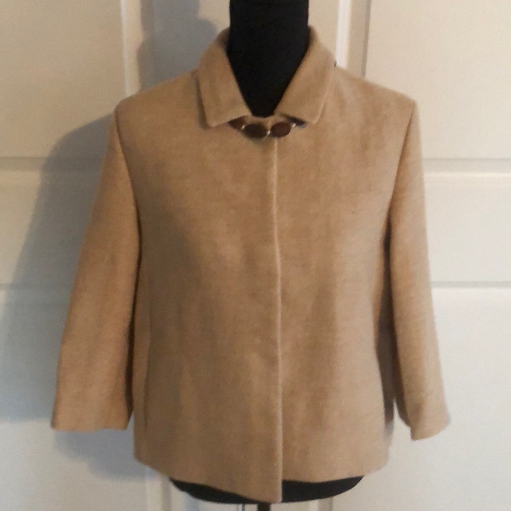 Cream colored Maje woven jacket.